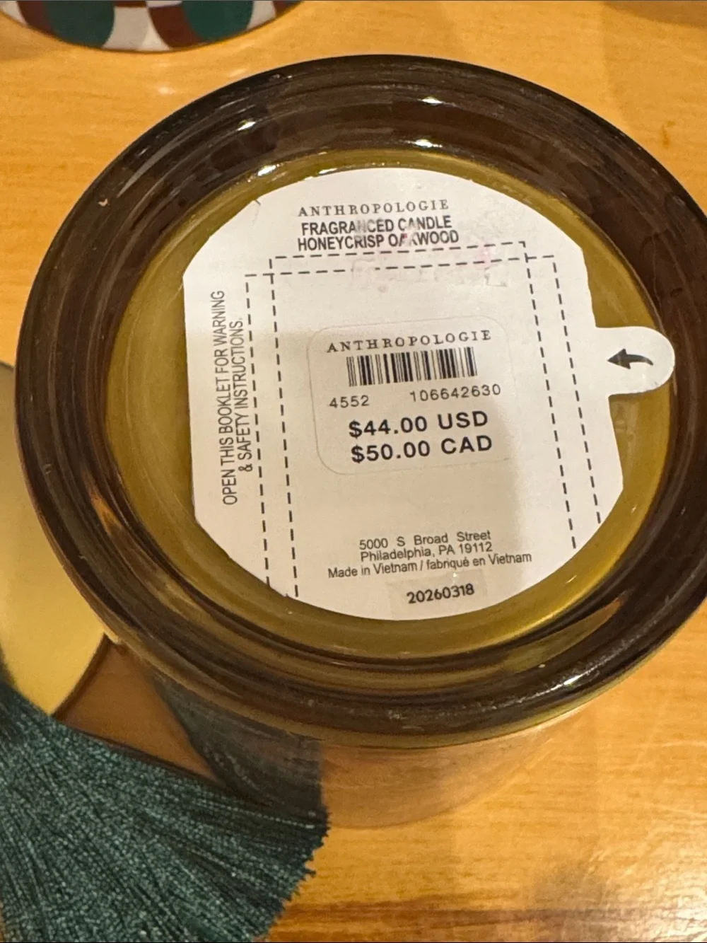Anthropologie Honeycrisp Oakwood Glass Candle with Gold Lid and Teal Tassel